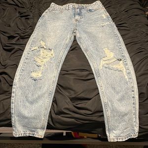 Light Wash High Waisted Ripped Jeans in the size medium, never worn